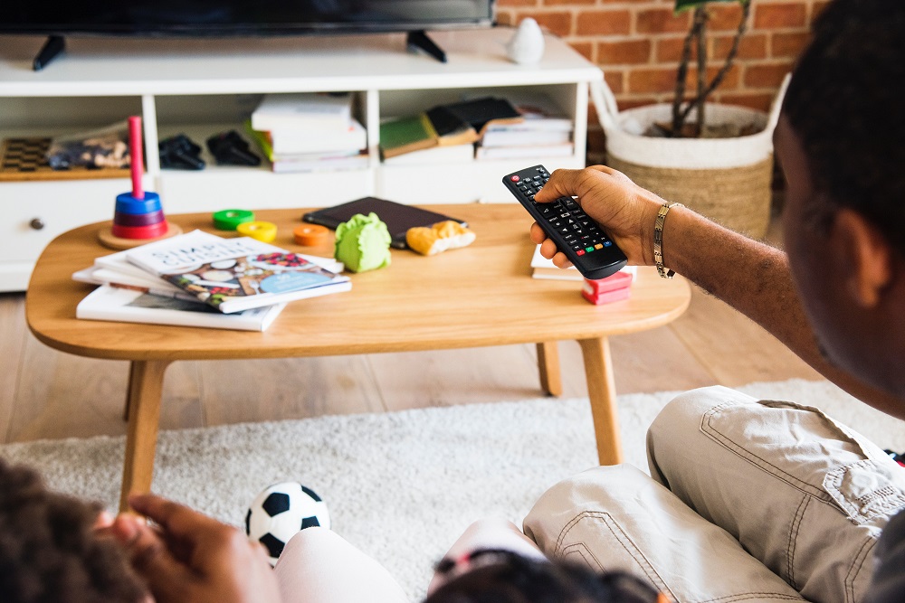 Remote control pointed at a television